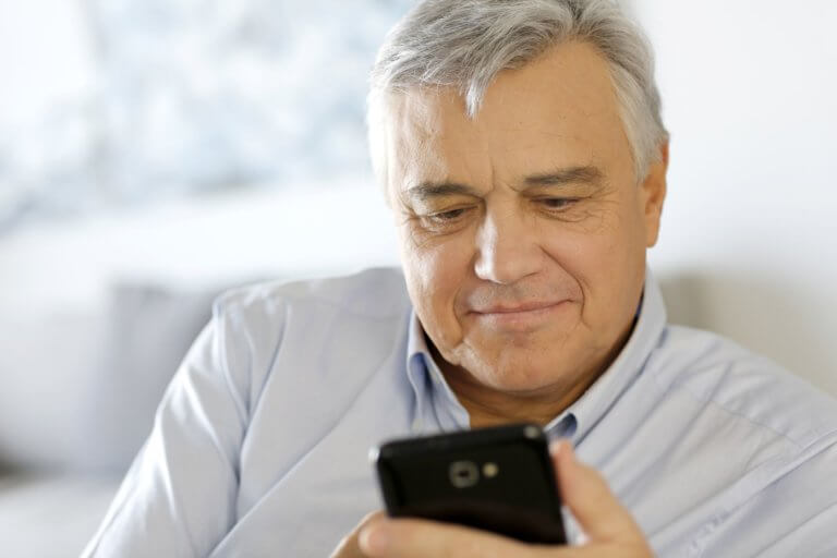 Man reads email on his smartphone